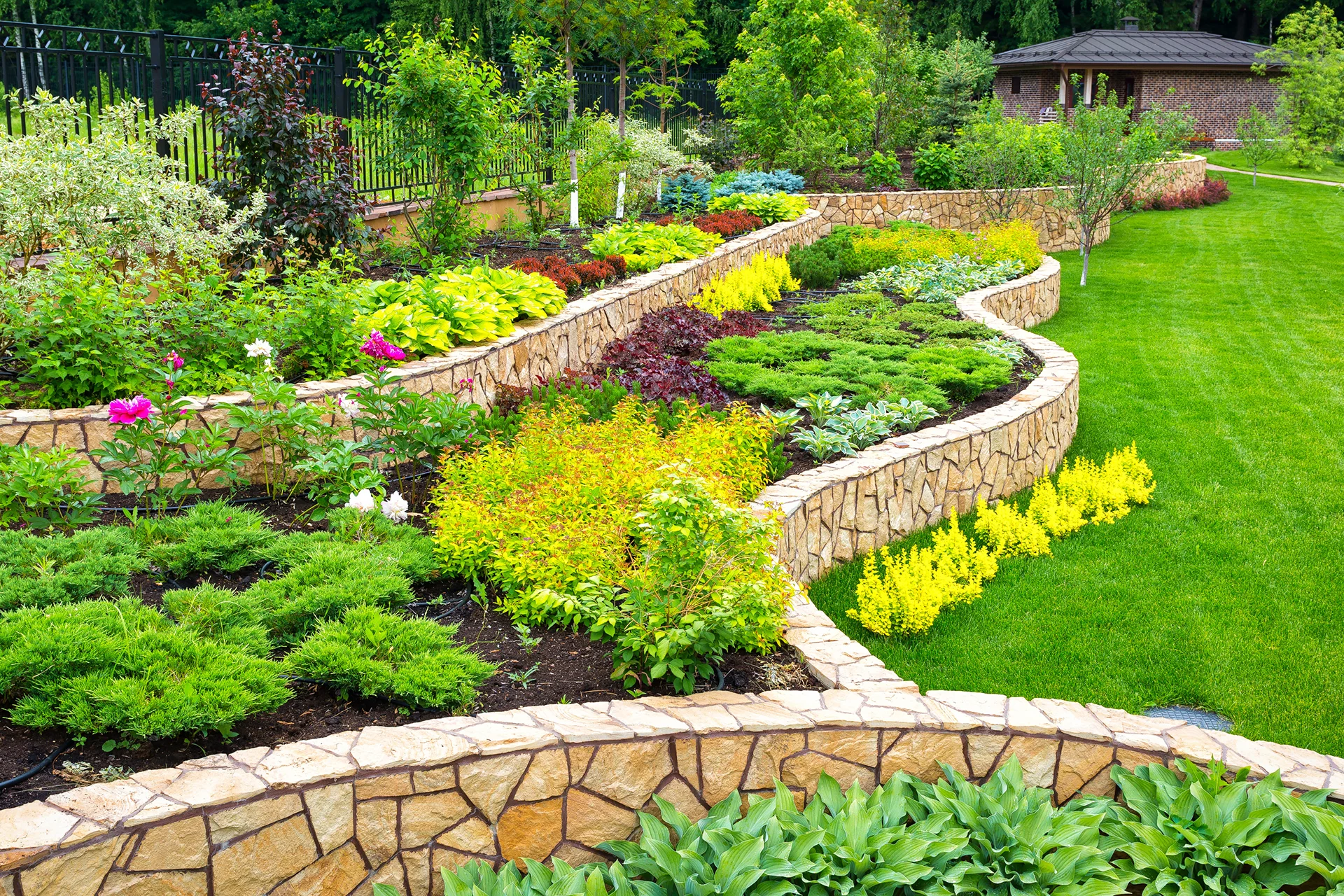 tiered stone retaining wall garden